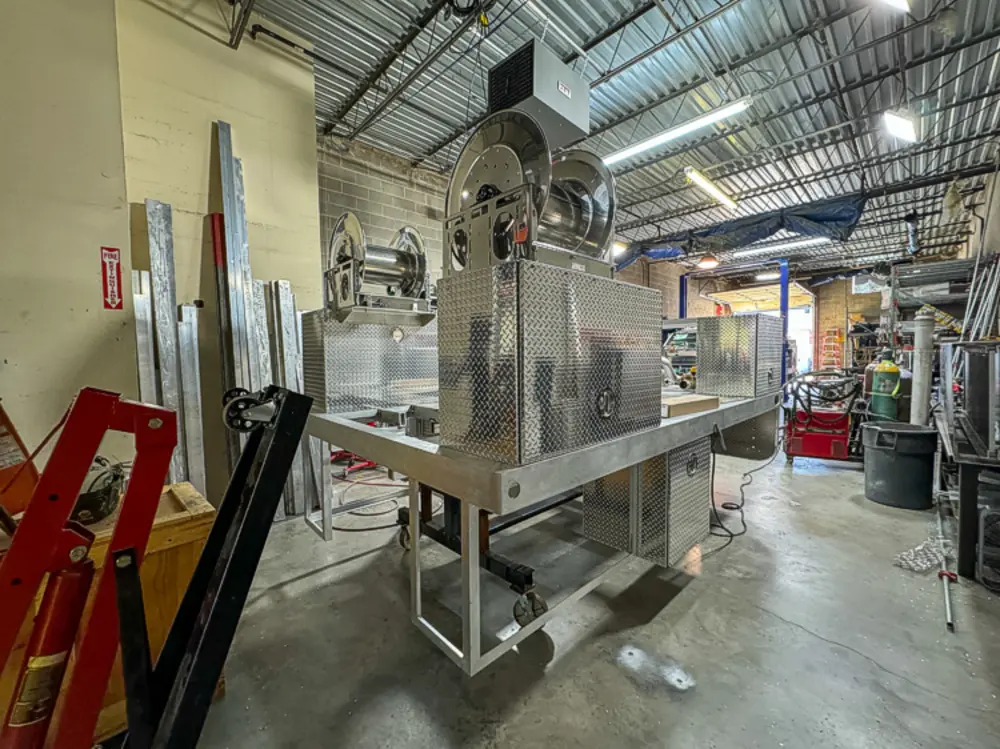 Apparatus in production bay with hood open, photo 151 of 303.